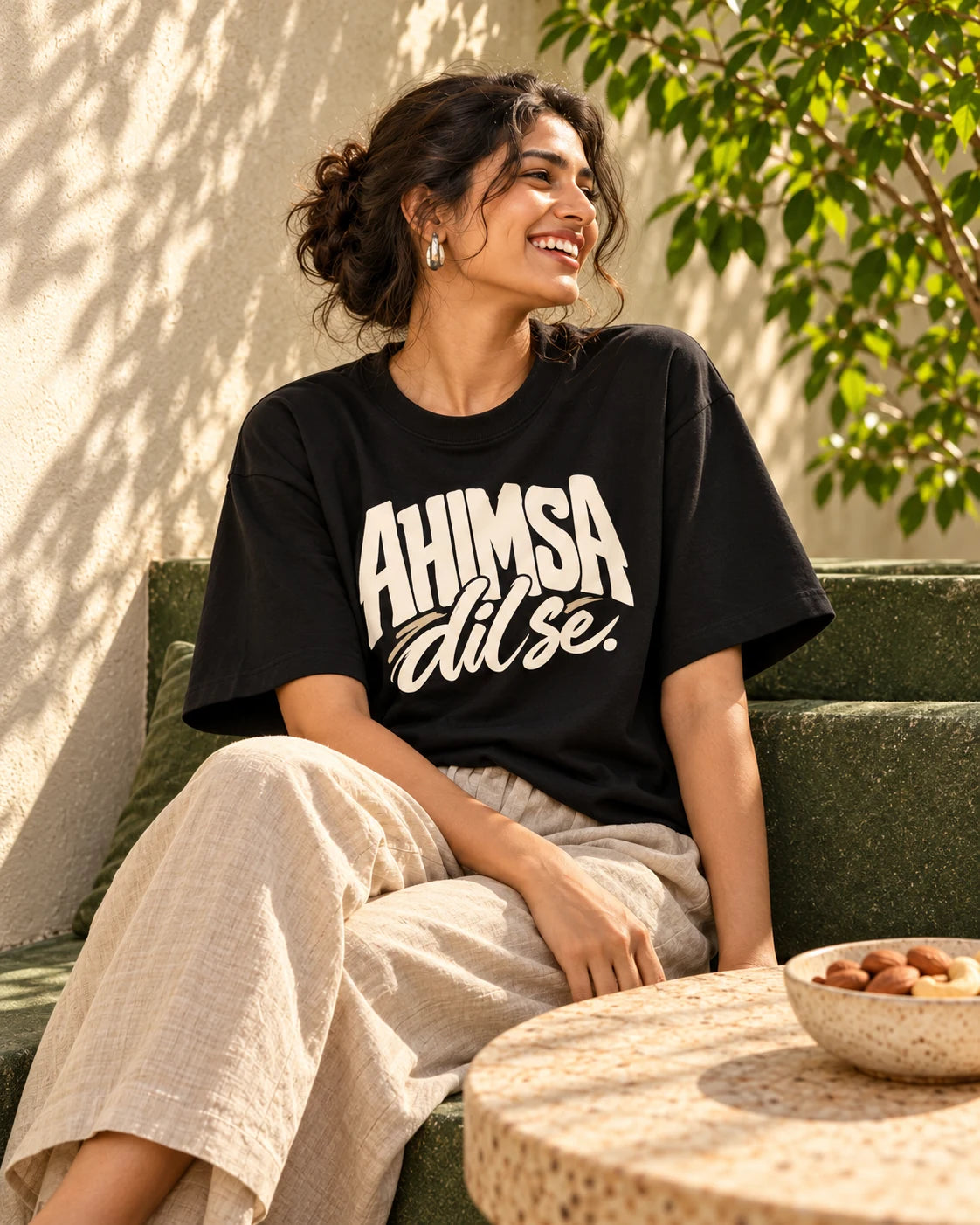 Indian adult wearing the Ahimsa, dil se oversized black T-shirt — Styling illustration