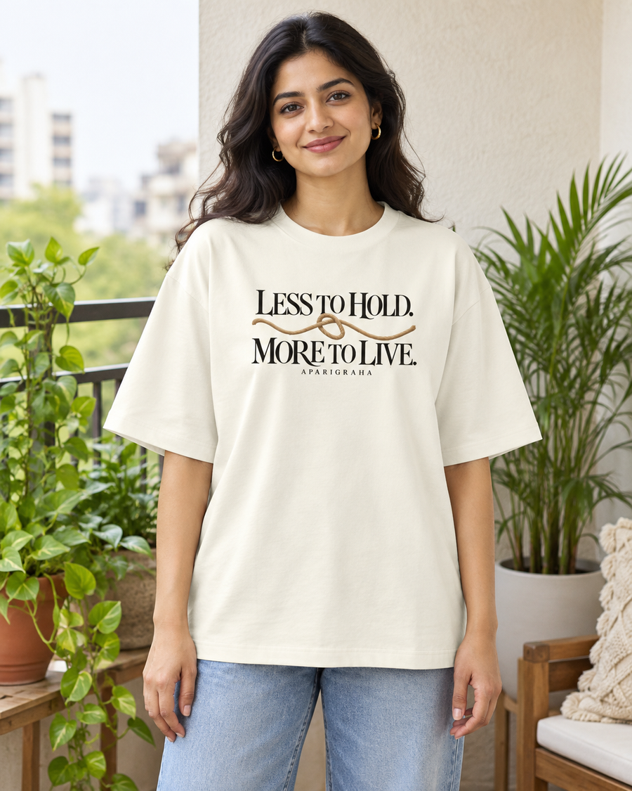 Less to hold. More to live. — front view · Off White oversized T-shirt · Styling illustration.