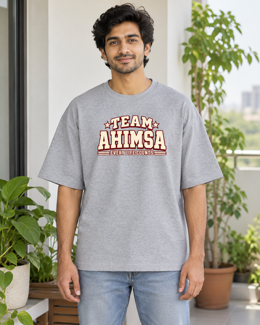 Team Ahimsa — front view · Grey Melange oversized T-shirt · Styling illustration.