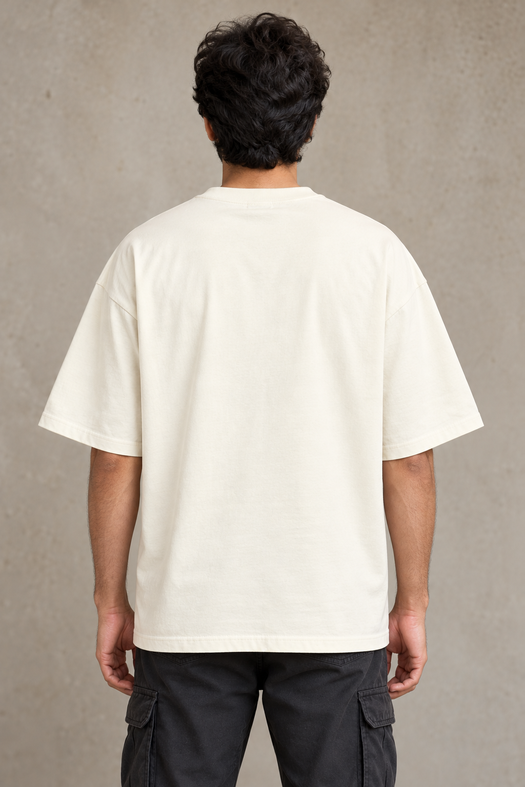 Styling illustration · plain back view · Off White Qikink UC22 oversized T-shirt on an Indian adult model. Shared view of the same unprinted garment surface; not a produced-sample photograph.