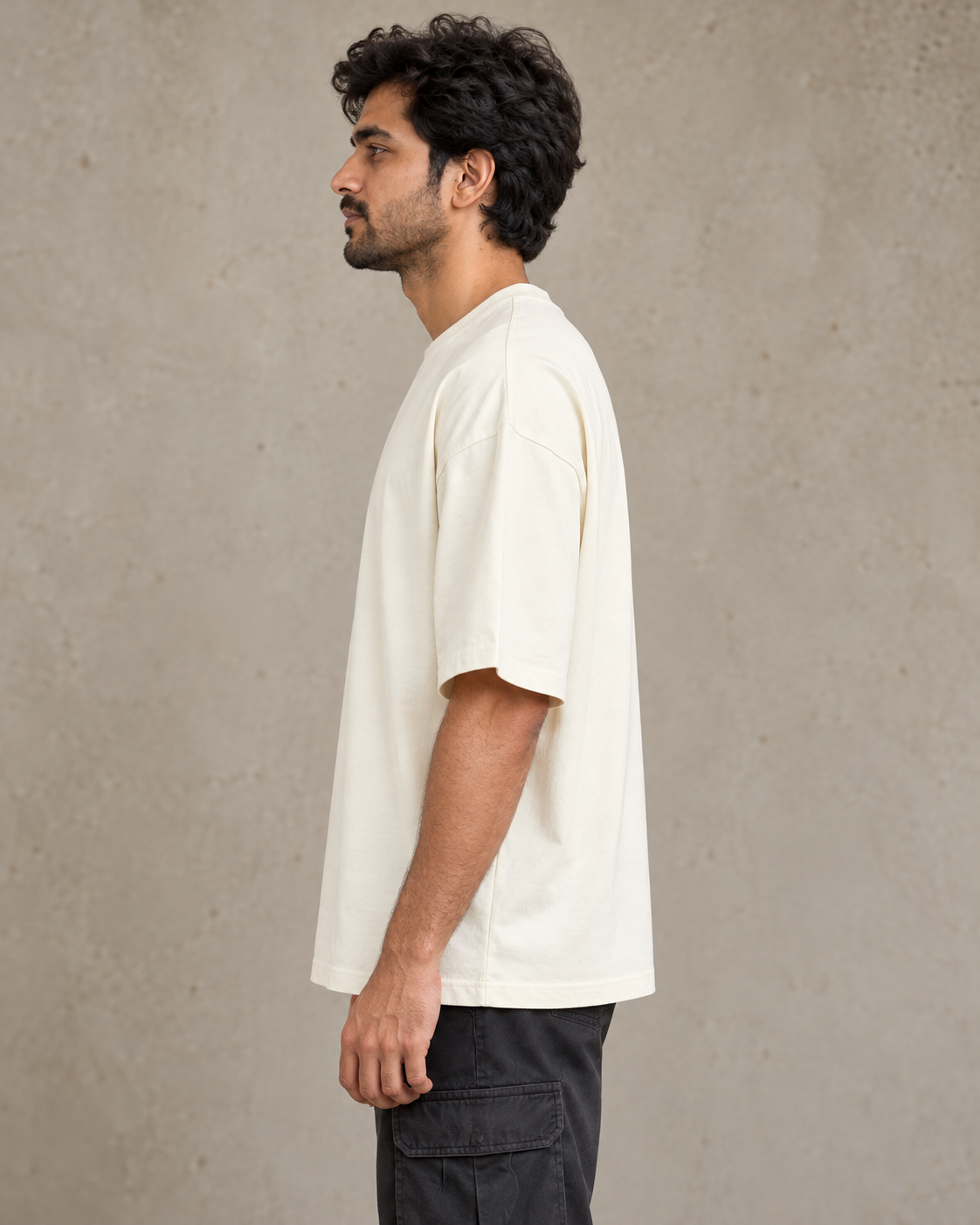 Styling illustration · left side profile · Off White Qikink UC22 oversized T-shirt on an Indian adult model. Shared view of the same unprinted garment surface; not a produced-sample photograph.