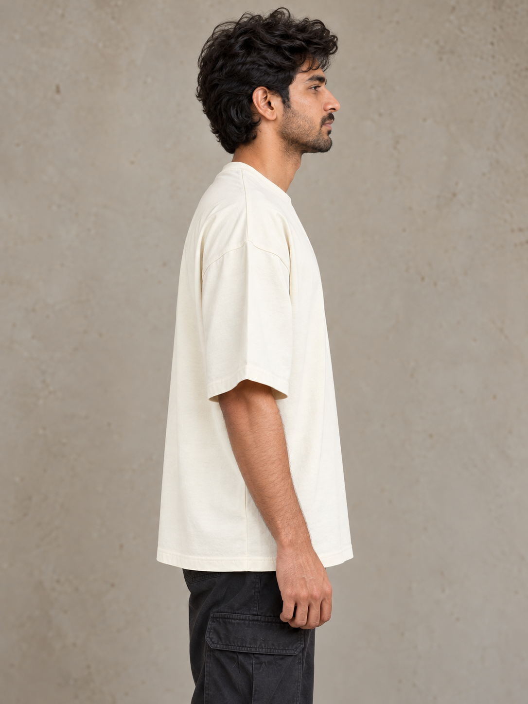 Styling illustration · right side profile · Off White Qikink UC22 oversized T-shirt on an Indian adult model. Shared view of the same unprinted garment surface; not a produced-sample photograph.